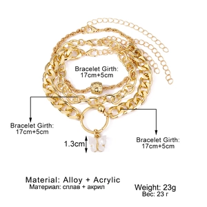 4-piece layered gold heart bracelet set with butterfly pendant on white background