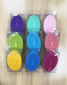 Detailed collection of colorful silicone baby bath brushes in individual clear packaging
