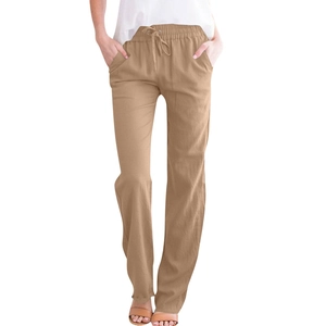 Close-up of khaki cotton linen trousers featuring drawstring waist and fabric texture