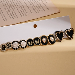 Retro butterfly and heart stud earring set with diamond accents on display card
