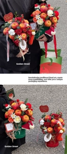 Detail of Christmas apple flower box with red roses and festive Santa decorations