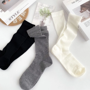 Detailed close-up of breathable mesh cotton socks in black, gray, and white colors