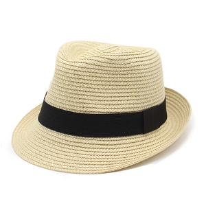 Classic straw Panama fedora hat with black ribbon band for sun protection on white background