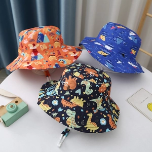 Set of three cotton cartoon dinosaur bucket hats for kids in orange, blue and black