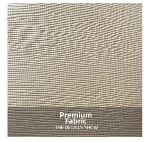 Close-up of beige woven fabric detail with thick horizontal texture on small chain bag