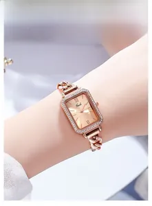 Close-up of Gedi women's rectangular rose gold watch with diamond bezel and chain strap