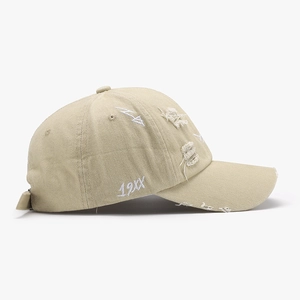 Retro khaki cotton baseball cap with distressed details and 19XX embroidery on white background