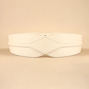 Close-up of cream wide waist cincher with diamond quilted stitching on leather texture