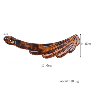 Detailed size specifications for a retro tortoiseshell resin banana hair clip in amber