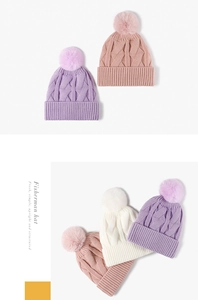 Close-up of thick diamond knit texture and fluffy pom-pom detail on women's winter hats