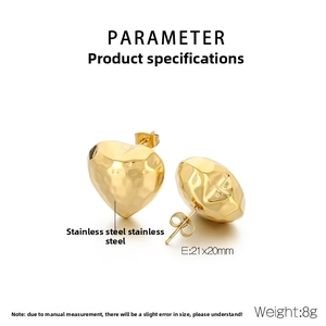 Detailed view of gold stainless steel heart earrings with hammered texture finish