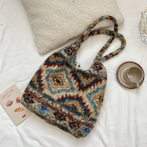 Close-up of geometric plush tote bag featuring soft fleece fabric and gingham lining
