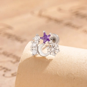 Silver star and snowflake screw back stud earrings with purple zircon on vintage book