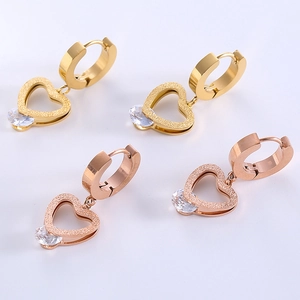 Frosted gold and rose gold heart huggie earrings with cubic zirconia crystals