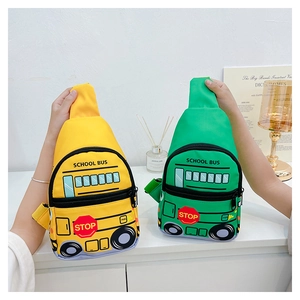 Detail of school bus shaped kids chest bags in yellow and green water-resistant fabric