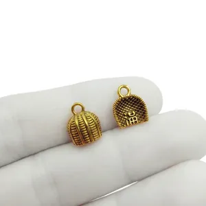 Detail of vintage gold peanut pendant with size measurements 10x11mm for DIY jewelry