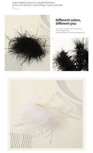 Detail showing elegant black and white ostrich feather hair clips on a minimalist tray