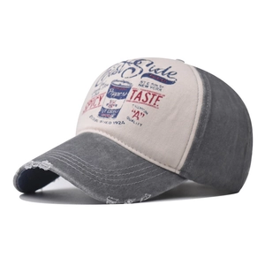 Detail of distressed grey washed denim baseball cap with vintage East Side pepper print