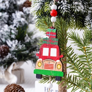 Detailed view of red wooden Christmas truck ornament hanging with festive wooden beads