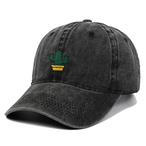 Close-up of vintage charcoal washed cotton baseball cap with green cactus embroidery detail