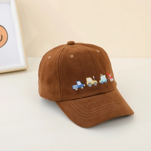 Detail of embroidered cartoon construction trucks on a brown cotton baseball cap for kids