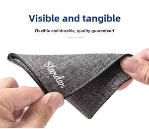 Close-up of a flexible dark grey canvas wallet showing high durability and fabric texture