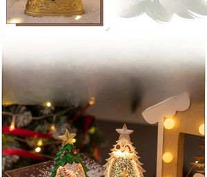 Detailed view of glowing Christmas tree snow globe with Santa and reindeer scene