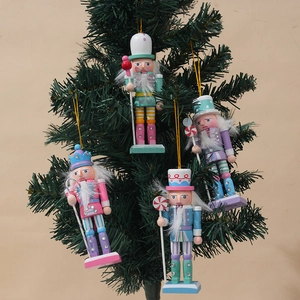 Set of four 12cm pastel nutcracker soldier wooden ornaments hanging on a Christmas tree