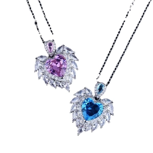 Luxurious angel wing heart necklace with blue and pink stones on silver chain