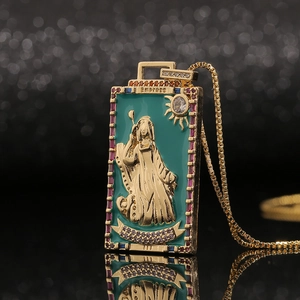 Macro shot of gold Empress tarot necklace with teal enamel and multicolored zircons