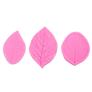 Pink silicone fondant leaf vein molds set with detailed textures for cake decorating