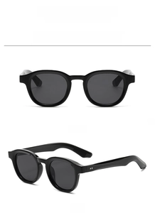 Detaillierte Ansicht der runden schwarzen Vintage-Sonnenbrille von vorne und der Seite