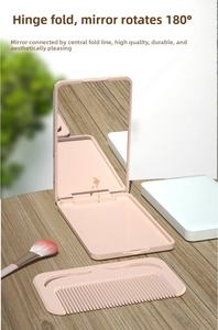 Detail showing the portable pink folding mirror with a 180-degree rotating hinge and comb