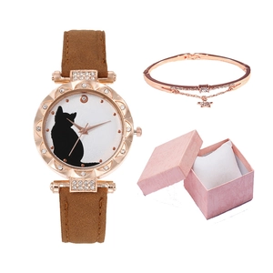 Close-up of ladies' cat silhouette watch with rhinestone bezel and rose gold bracelet