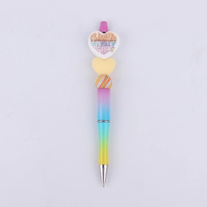 Detail of gradient DIY beaded pen with a heart charm and teaching themed inscription