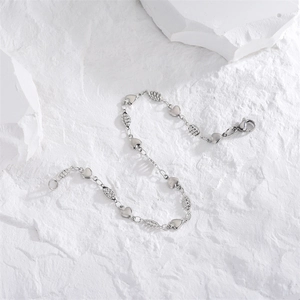 Bracelet en acier inoxydable argenté avec breloques cœur et perles ovales texturées