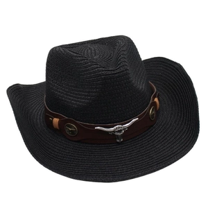 Close-up of black Western cowboy straw hat featuring a metal bull head accessory