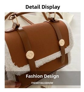 Detailed view of the brown leather texture and white faux shearling trim on the handbag