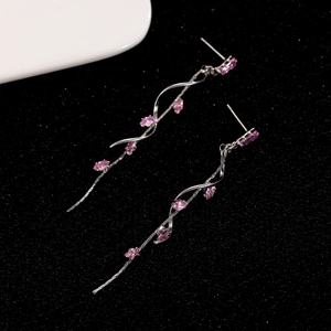 Detail of silver long tassel earrings with pink marquise zircon in a spiral wave design