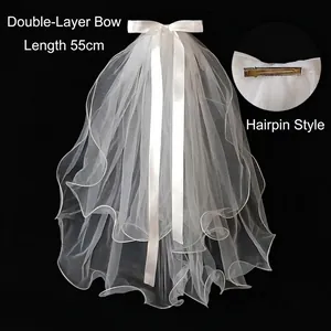 Detail of white double-layer short bridal veil with satin bow and 55cm length