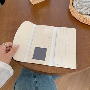 Three-fold cream long wallet for women with multiple card slots and an ID window