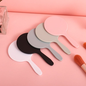Set of five colorful mini handheld makeup mirrors with handles in a fan layout