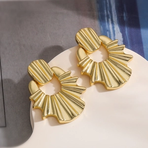 Irregular textured gold fan-shaped drop earrings with a modern geometric shell design