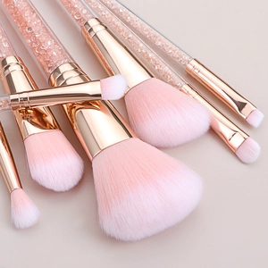 7-piece pink makeup brush set with rose gold ferrules and crystal-filled handles