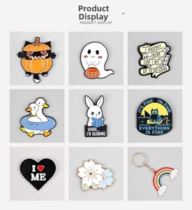 Detailed grid of Halloween cartoon enamel pins featuring ghosts and pumpkin cats