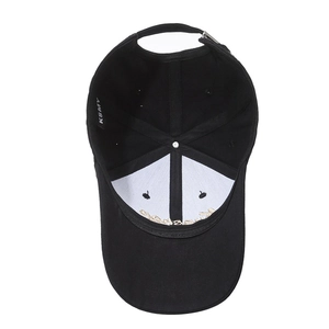 Interior view of black cotton baseball cap showing 6-panel structure and embroidery
