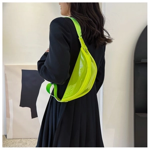 Neon green transparent PVC fanny pack shown on a model with an adjustable strap