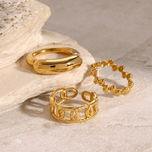 Minimalist gold stainless steel ring set with smooth, beaded, and link texture designs