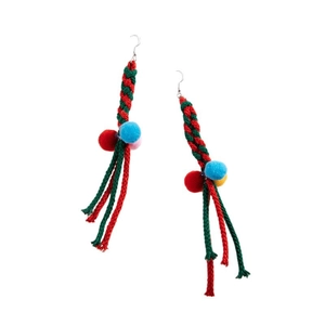 Colorful woven Christmas earrings with festive pom-poms and fringe on white background