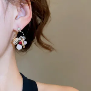 Vintage zircon hoop earrings with red and white beads on a model, aesthetic ethnic style
